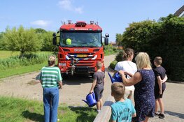 Brand in bosschages in Oudeschild geblust door buurtbewoners met gieters en emmers